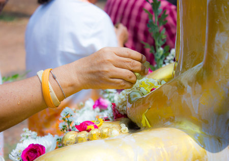 Showering Buddha statue in SongKran festival, Thailandの写真素材