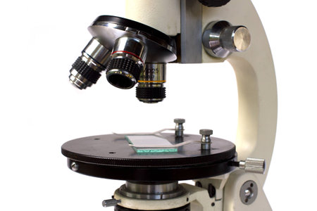 High performance optical microscope on white background.の写真素材
