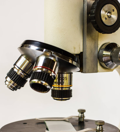 High performance optical microscope on white background.の写真素材