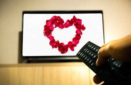 turn on, turn off television with heart imageの写真素材