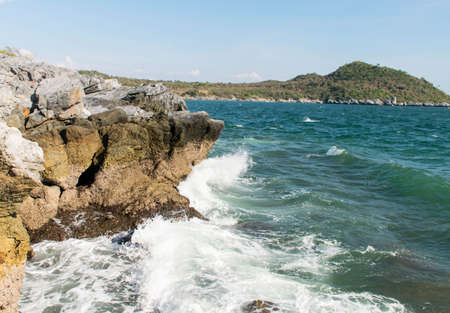 many waves from the sea are impact  rock at the beachの写真素材