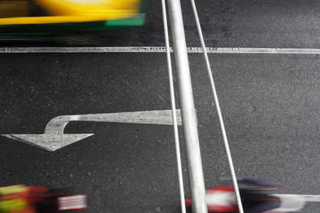 White Directional Arrow on Asphalt の写真素材