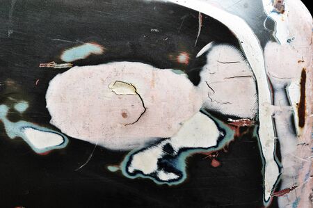 Closeup of cracked and peeling paint on an old carの写真素材