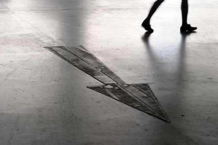 arrow sign on surface of  floorの写真素材