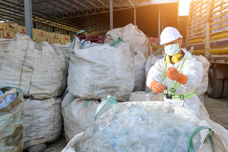 plastic bottles recycle background concept, picking up garbage plastic bottles  for recycling conceptの写真素材