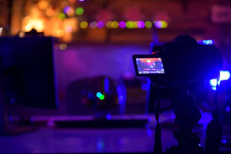 Podcasts and Stream. Flat lay. Studio condenser microphone black with professional headphones, top view with space for design at night.の写真素材