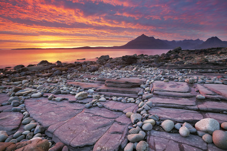 The beach of Elgol on the Isle of Skye, Scotland with The Cuillins in the background. Photographed at sunset.の写真素材