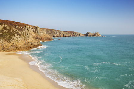 A beautiful beach with turquoise water at Porthcurno in Cornwall, England.の写真素材
