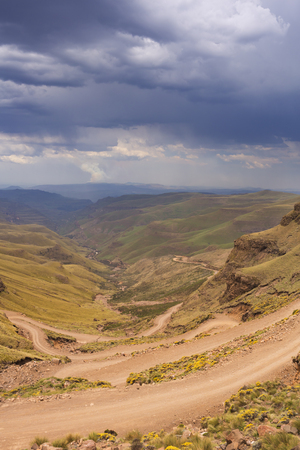 Endless hairpin turns on the dirt road leading towards the Sani Pass on the border of South Africa and Lesotho.の写真素材