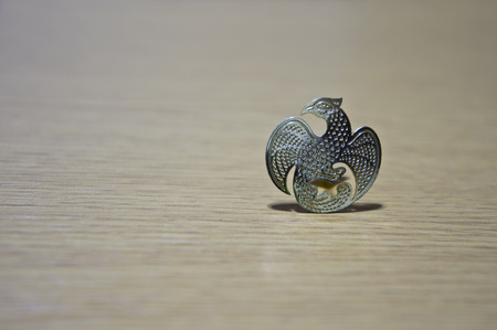 Symbol of Thai Ministry of Finance on wooden background.の写真素材