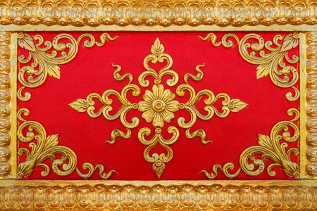 Pattern of flower carved on cement wall background.の写真素材