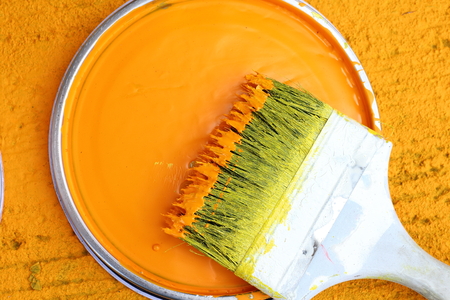 color and paint brush and yellow backgroundの写真素材