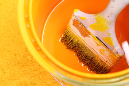 color and paint brush and yellow backgroundの写真素材