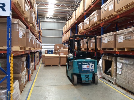 Lift truck in factory warehouse area