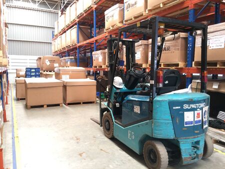 Lift truck in factory warehouse areaの素材