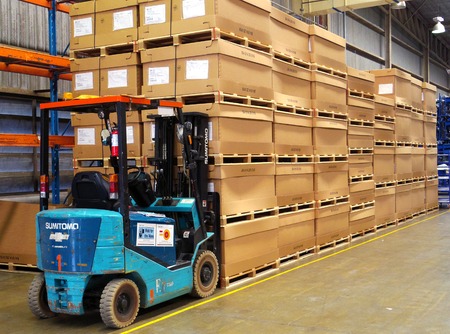 Rayong province Thailand , December 13 - 2017 : Lift truck and material boxes in factory warehouse.のeditorial素材