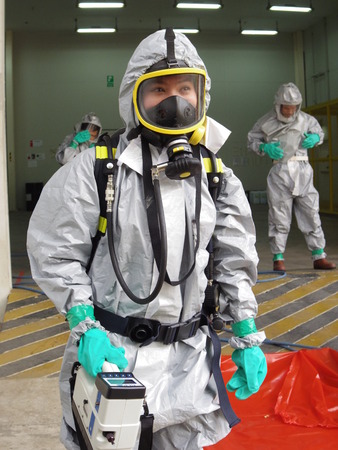 Rayong Thailand , February 09 - 2018 : Emergency team wearing chemical protection suit for work in dangerous chemical in factory.のeditorial素材