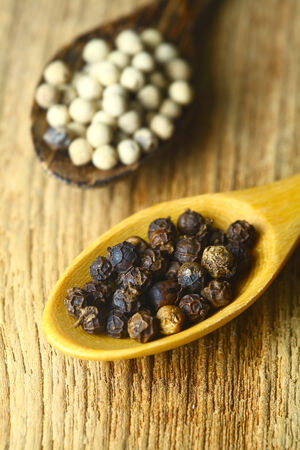 close up of the white pepper and black pepper.の写真素材