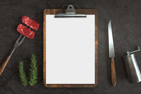Menu mockup with knife and fork on a Concrete background, Free space for your text. 3D illustrationの写真素材