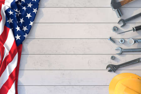 Labor Day, Set of mechanical tools on a wooden table with American flag. 3D illustrationの写真素材