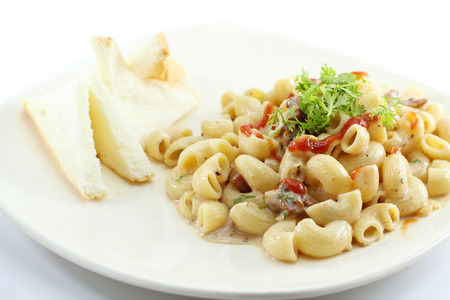 elbow macaroni pasta with carbonara sauceの写真素材