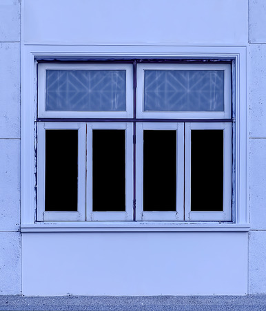 old window in an ancient brick wall, blue tone colorの写真素材