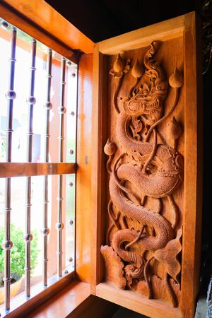 Wood-carving in temple thailandの写真素材