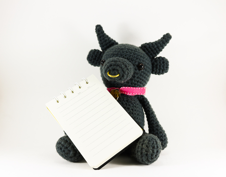 Black buffalo doll on white background isolated.の写真素材