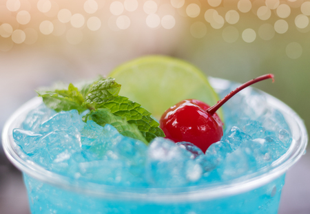 Close up blue hawaii Italian soda with cherry and mint.の写真素材