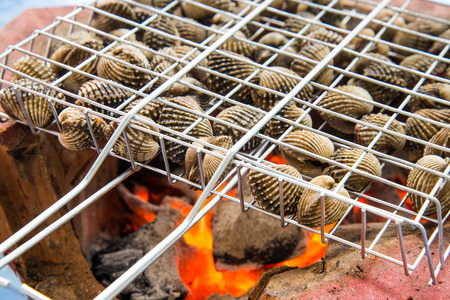 Scallops with charcoal fire Thailand food style.の写真素材