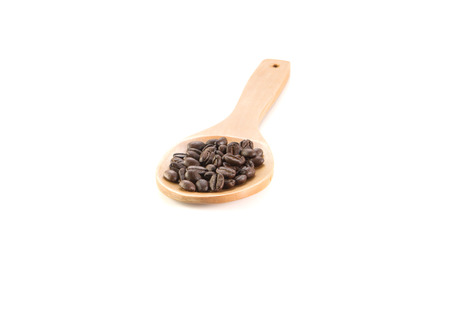 Fresh beans and wooden spoon on white background.の写真素材