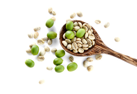 Fresh coffee in woden spoon placed on white background.の写真素材