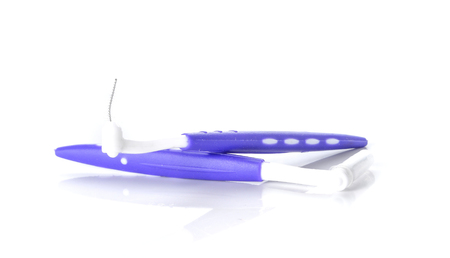 Two interdental brush placed on white background.の写真素材