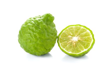Kaffir lime cut half,Full ball placed on white background.の写真素材