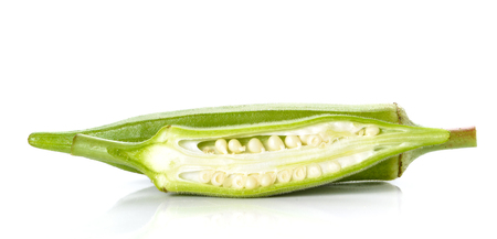 Okra cut pieces placed on white background.の写真素材