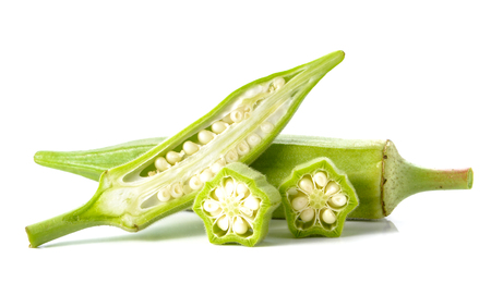 Okra cut pieces placed on white background.の写真素材