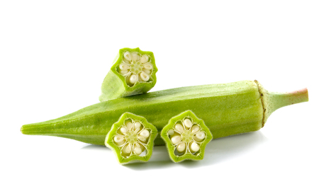 Okra cut pieces placed on white background.の写真素材