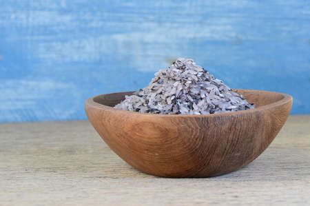 Rice berries in wooden bowls placed on wooden floor.の写真素材