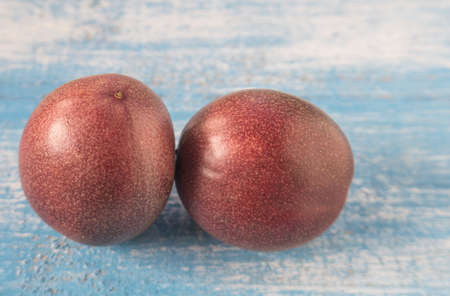 Passion fruit placed on Blue wooden floor.Selective focus.