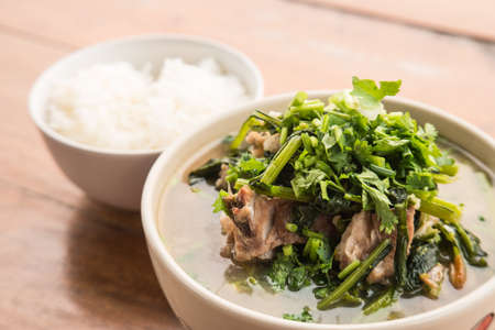 Curry Choy , vegetable Curry , Rice on wooden floor.Thai style cuisine.
