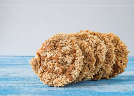 Rice crackers on Blue wooden floor.Focus Front.の写真素材