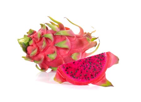 Fresh red dragon fruit cut pieces on white background.の写真素材