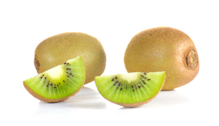 Kiwi cut pieces isolated on white background.の写真素材