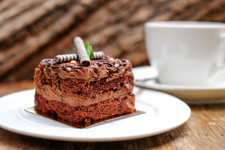 Chocolate cake and coffee cup on wooden.の写真素材