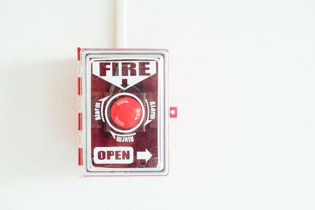 Switch fire alarm on white wall.の写真素材