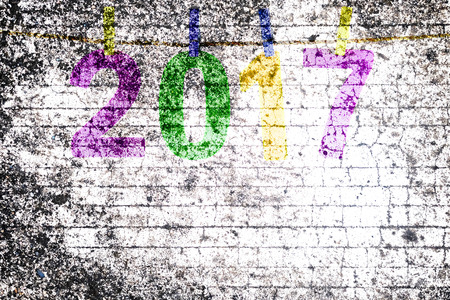 New Year 2017 number on vintage textured concrete wall.