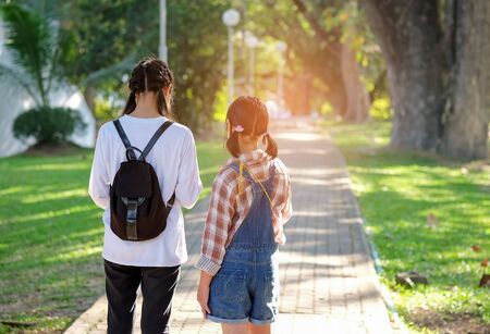 Asian students were walking to school.の写真素材