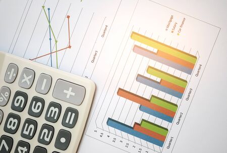 Business concept,Calculator on chart paper.の写真素材
