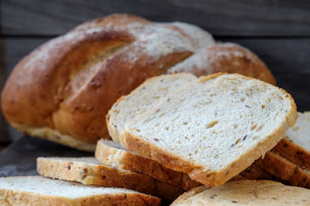 French bread slides on wooden floor.