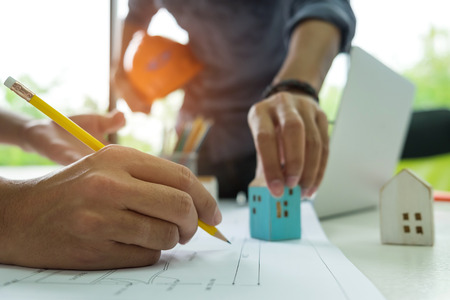 Engineers are helping to design the house,Engineers and designers are helping to design the...